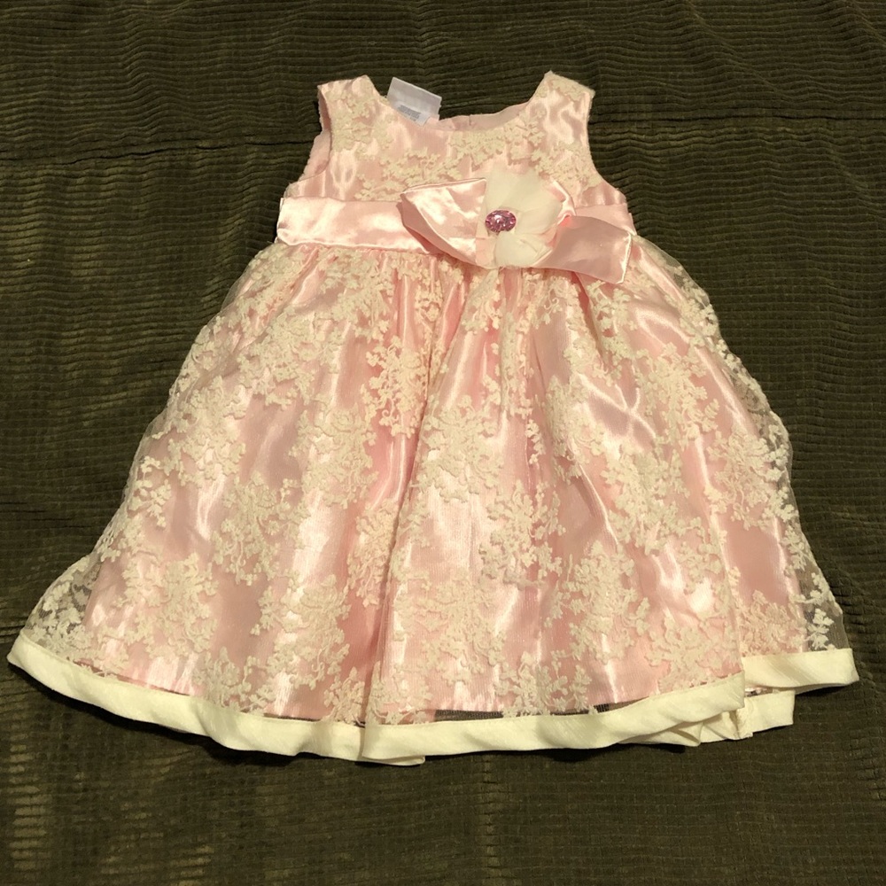 Little girls pink dress with flower